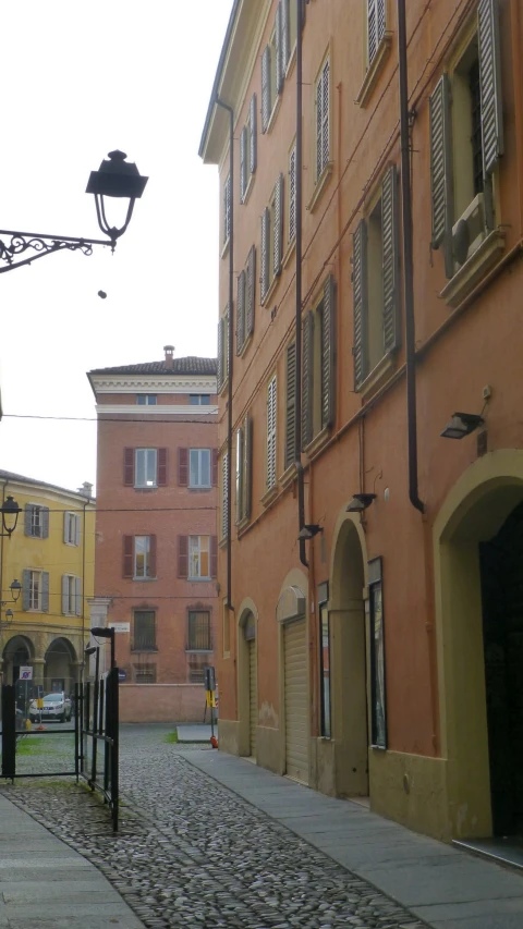 two buildings on the sides of a street in an old town