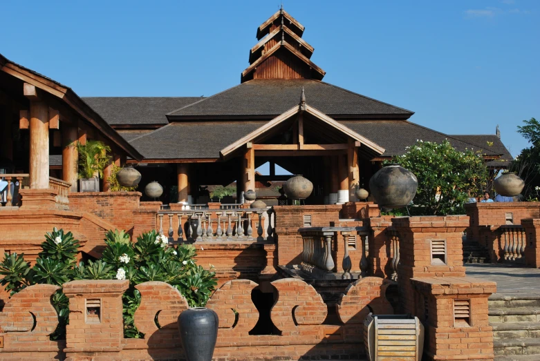 some old building with large pots on the outside