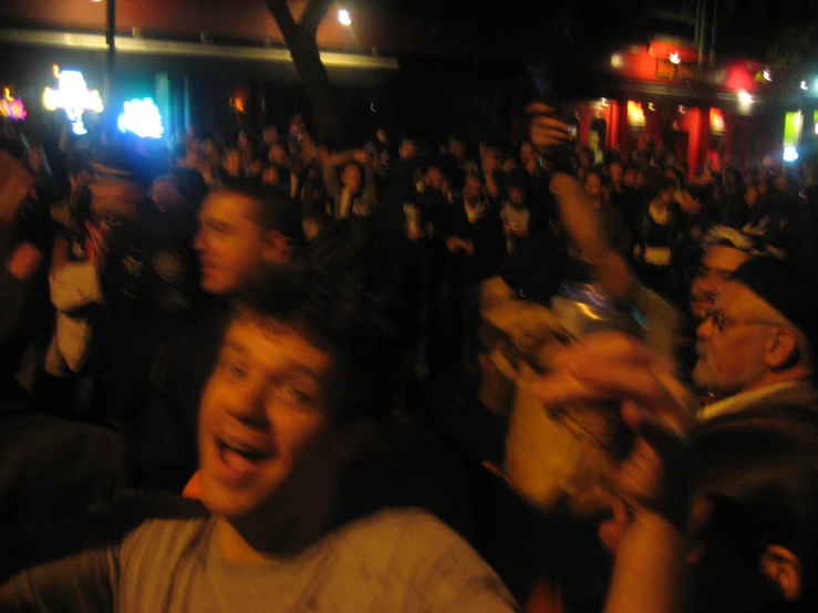 a large group of people in the dark at night