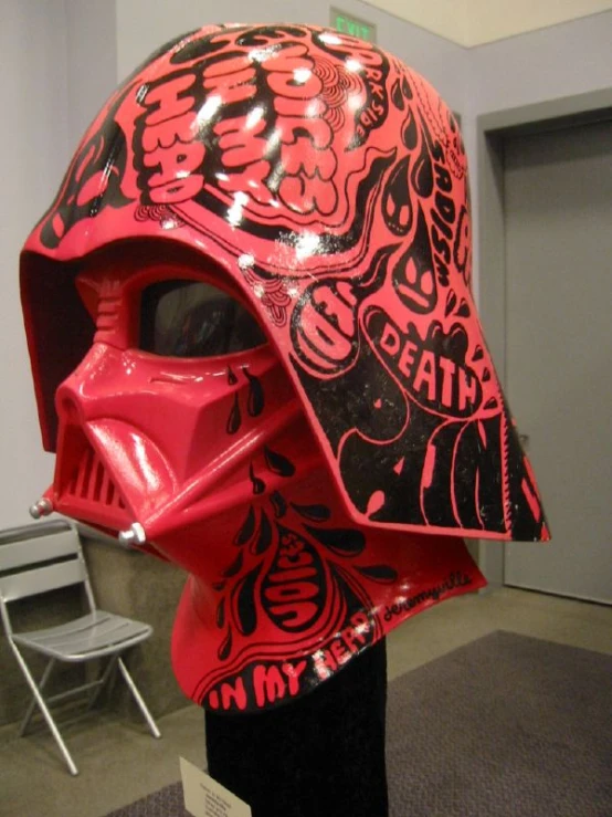 the helmet is red with black and red designs