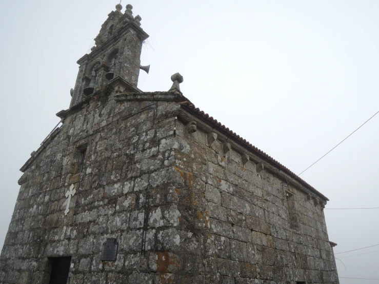 the old building has a small window and spire