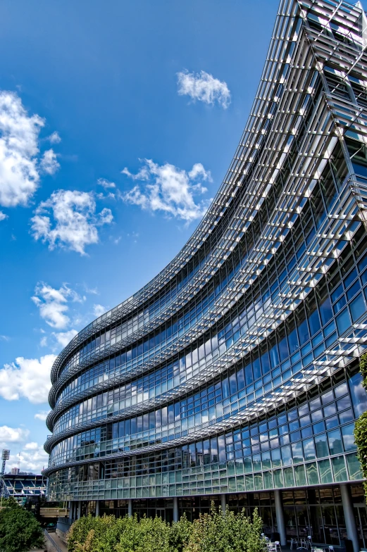 an upward view of an office building in an urban area