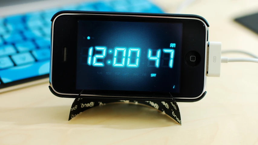 a digital clock is displayed on an iphone