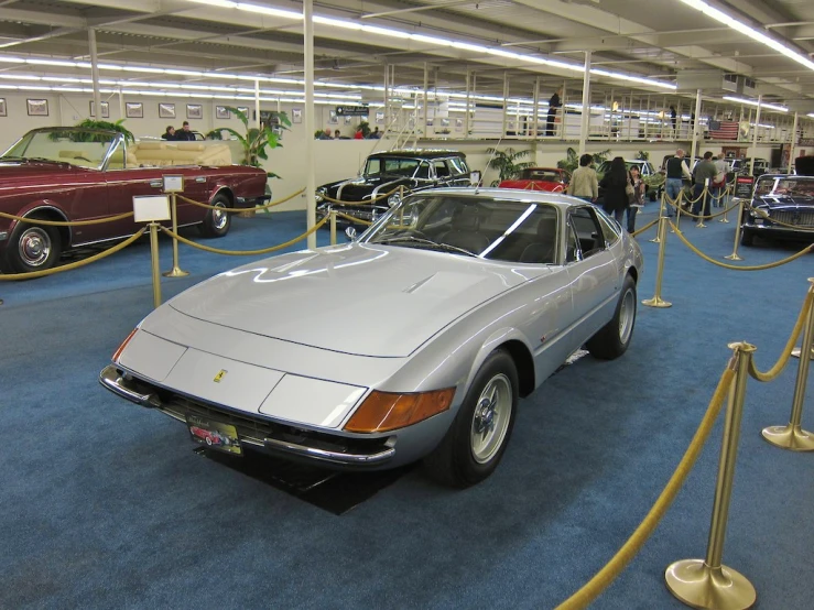 an interior area with many old classic cars