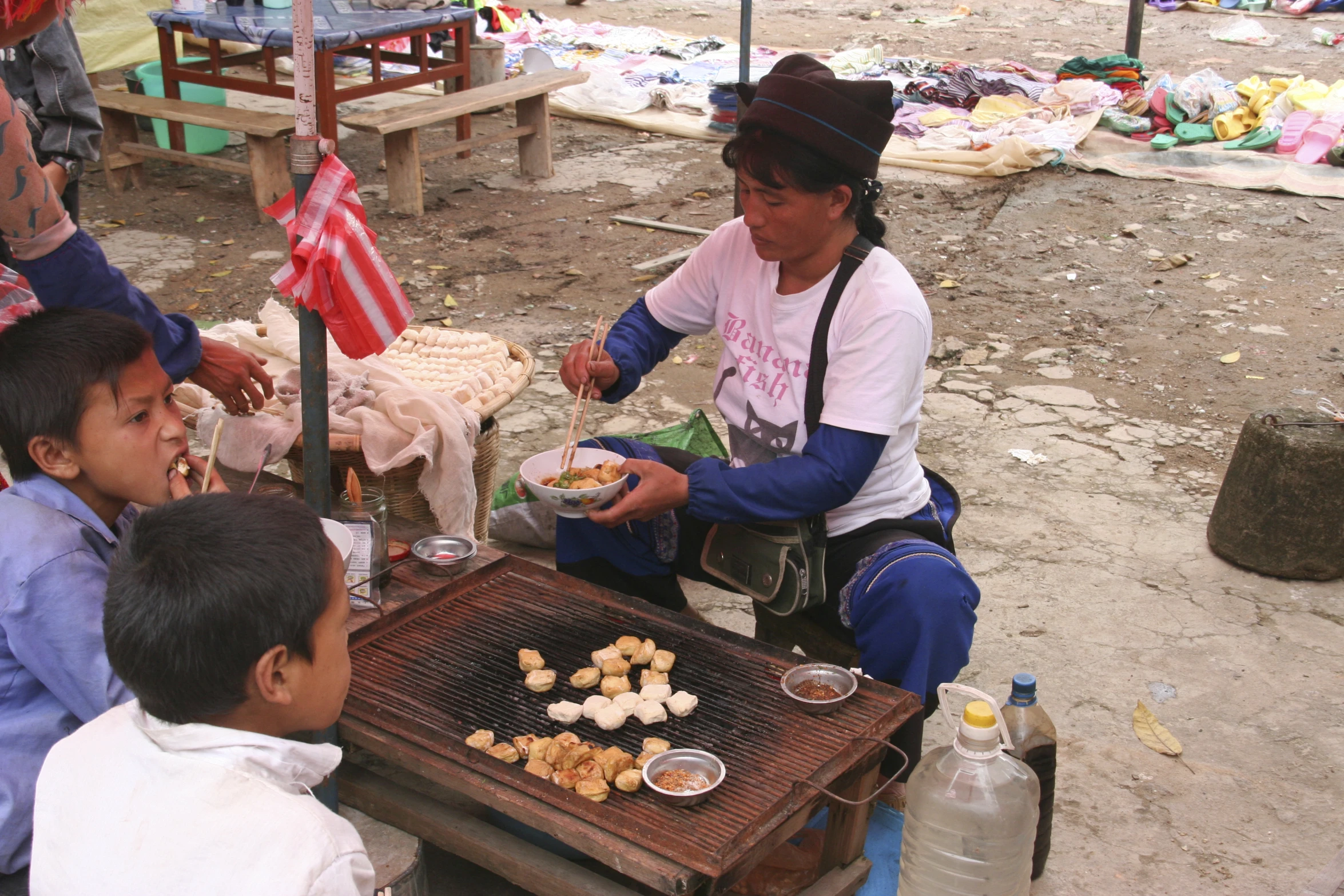 some women are sitting and having a snack