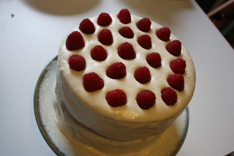 a cake is shown with some strawberries on top