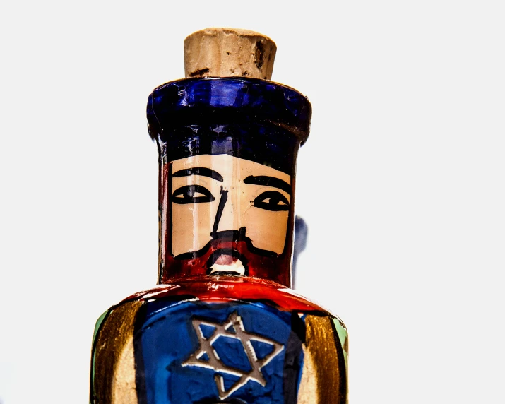 a glass bottle with an image of the star of david