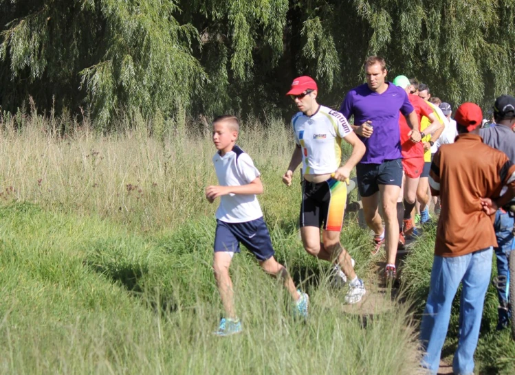 several men and women racing down a path together