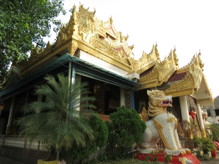 a very elaborate building with a statue at the front