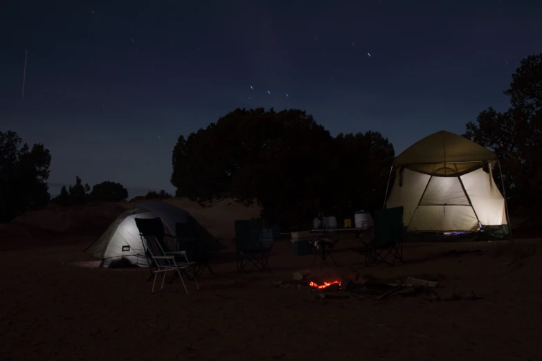 two canvas tents in the middle of an outback camp site