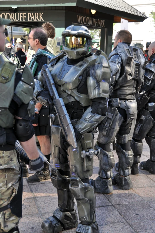 a number of people standing near one another in costume