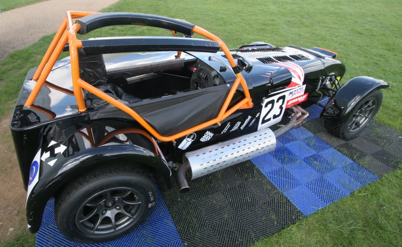 a vehicle sitting on top of a blue mat