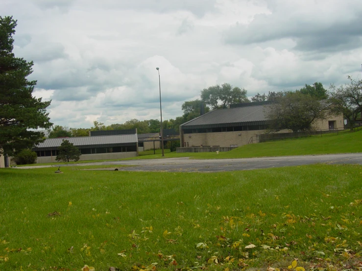 a picture of the outside of a building in a field