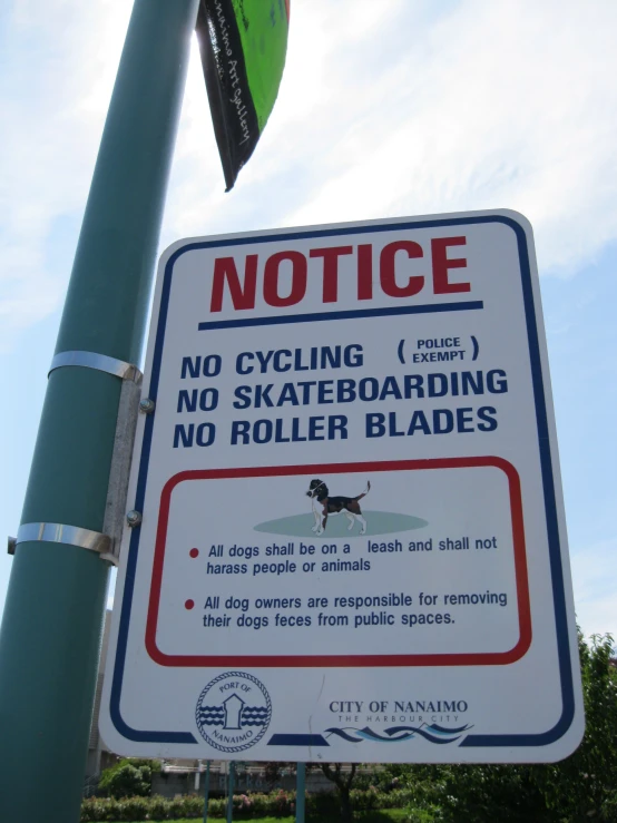 a sign on a pole stating that it is not allowed to ride bikes