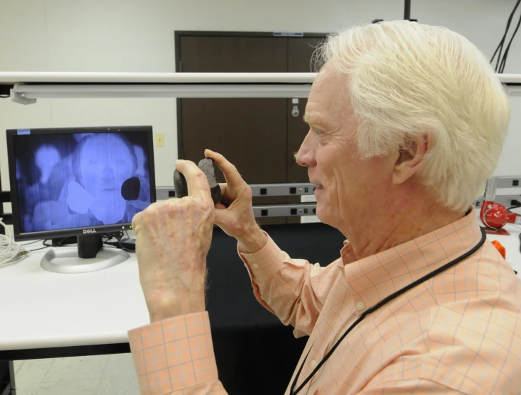 a person standing up holding a camera