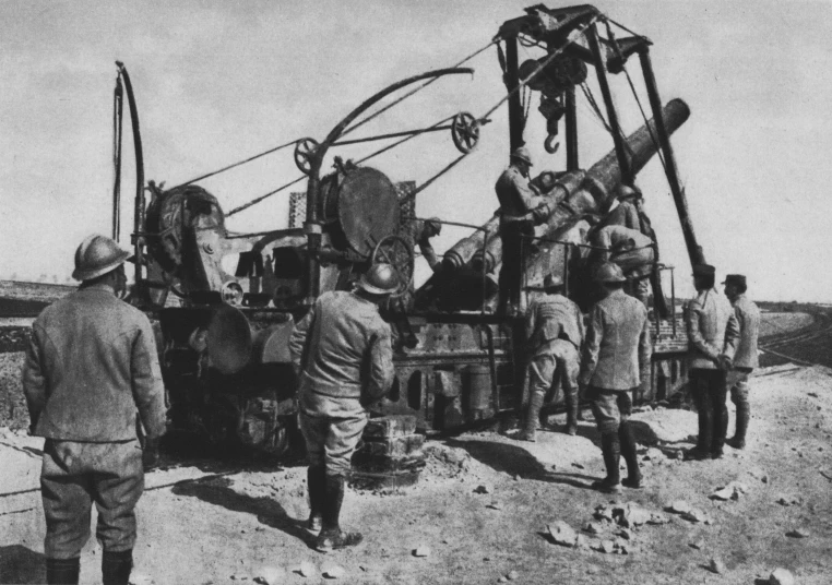 an old po of a group of men working on a large machine