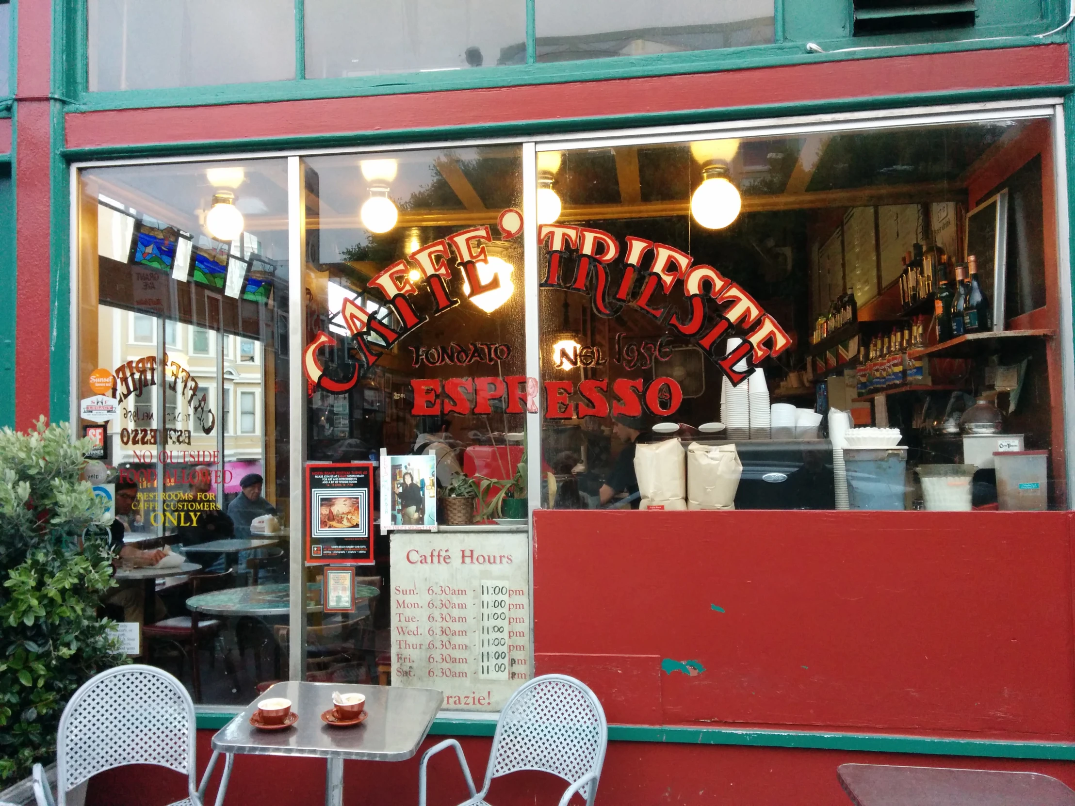 a small cafe is showing the menu inside