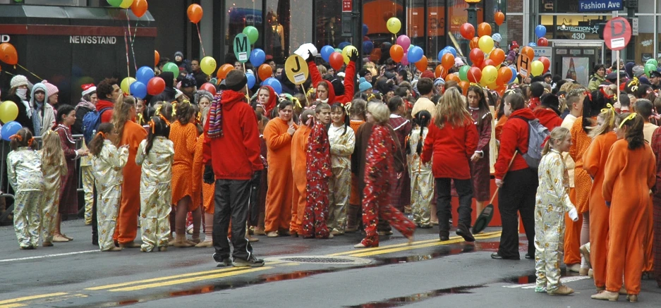 a group of people stand in the middle of the road in costume
