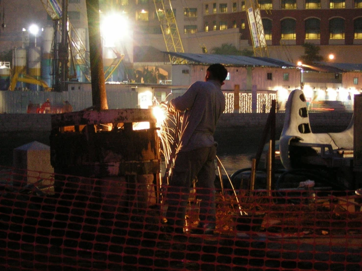 a man working at a gas station at night