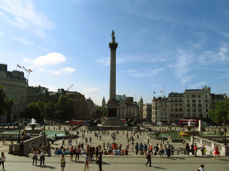 the large statue stands in a city square