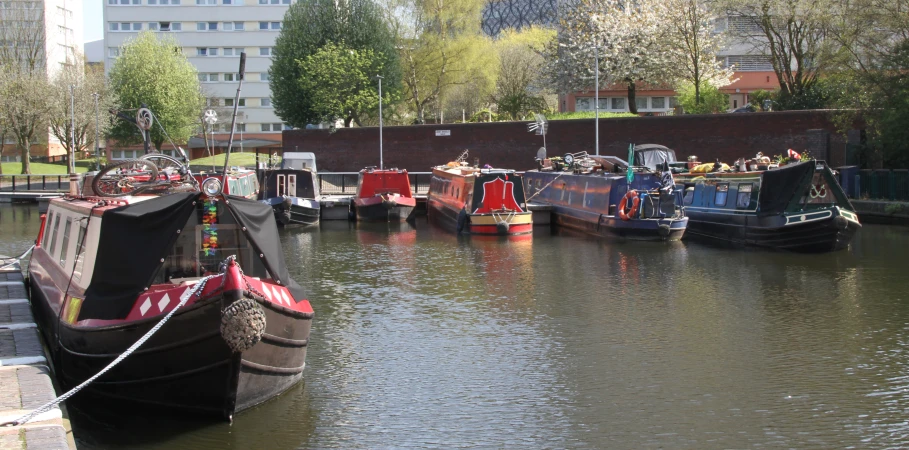 some boats on the water near buildings