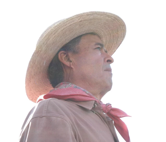 an older man wearing a large straw hat