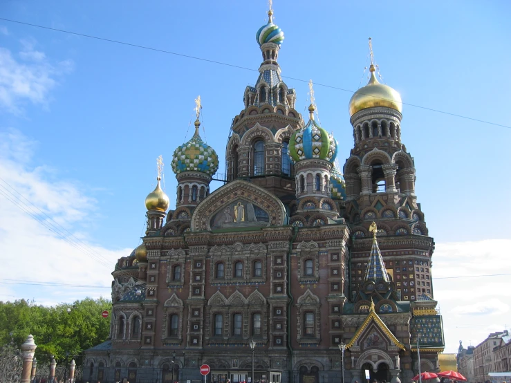 a church with two domes sitting on a street