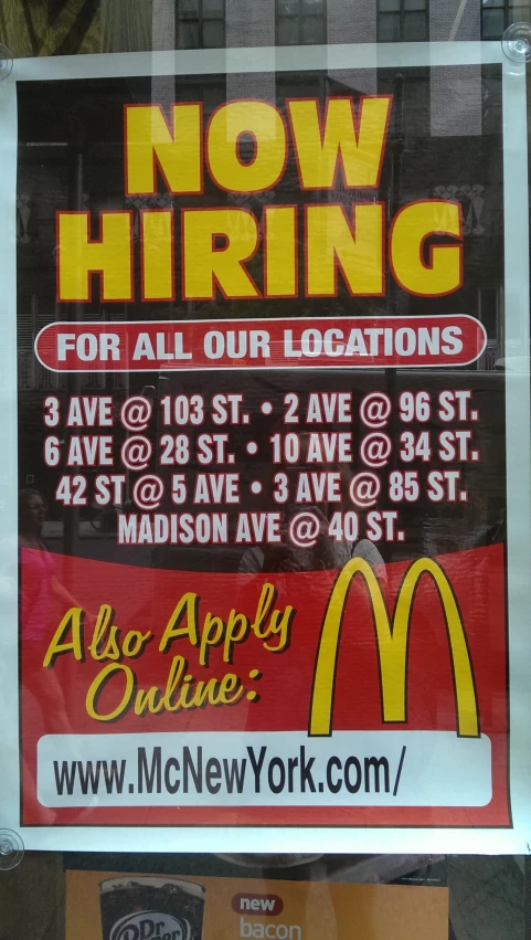 a sign reading now hiring for all our locations