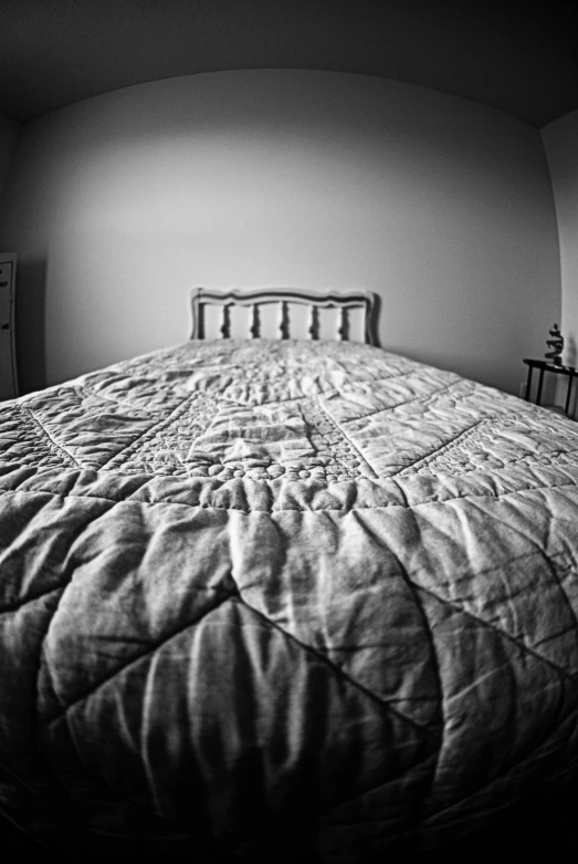 a black and white po of an empty bed