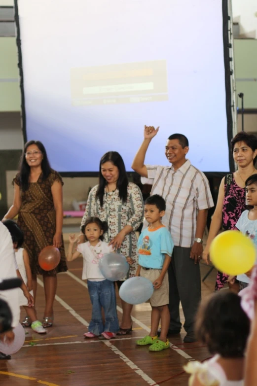 two groups of people standing in front of an event