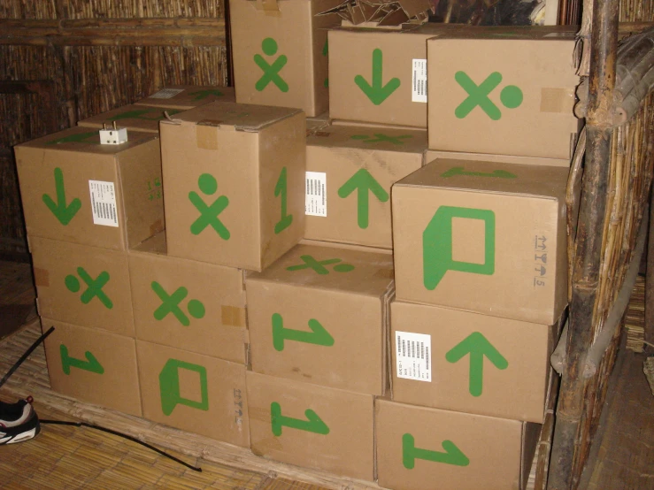 several cardboard boxes stacked in a large room