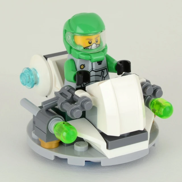 a lego man sitting on top of a car