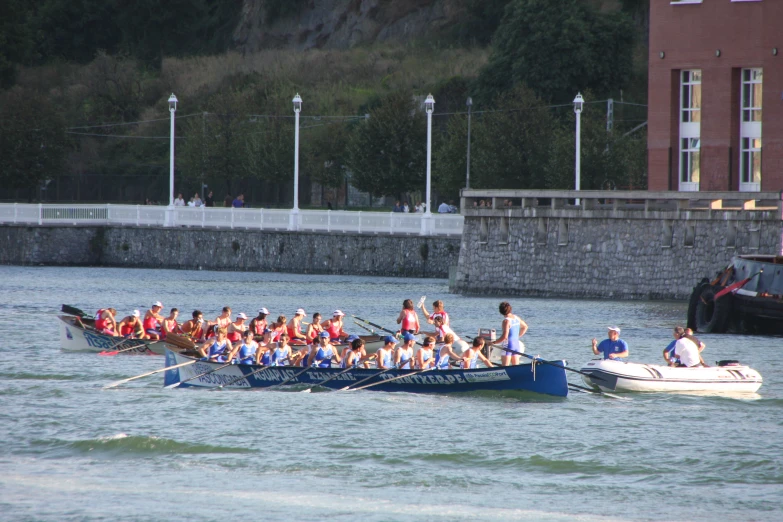 many people in boats on a body of water