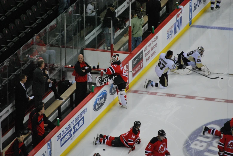 the teams playing hockey are in a rink