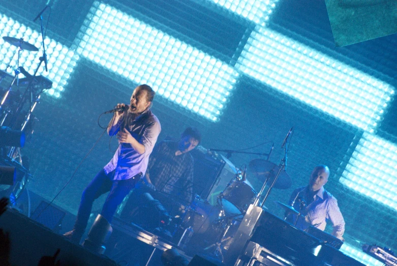 a band is on stage during a concert