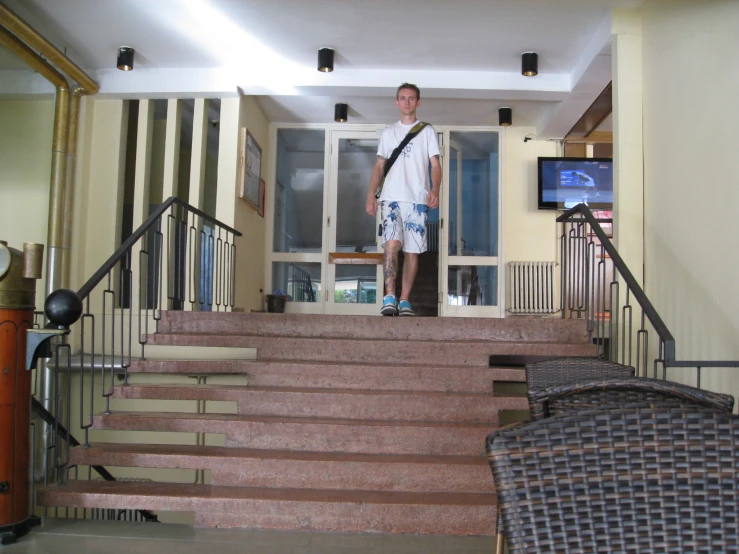 a man is standing on a set of stairs