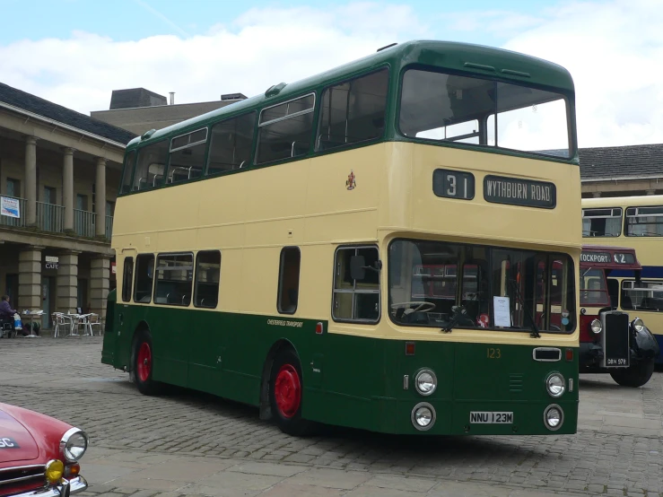 a double decker bus parked in a parking lot