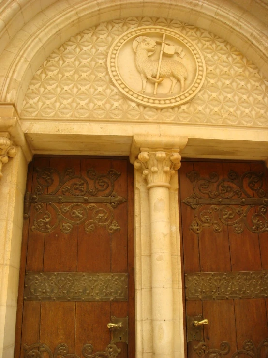 close up of an ornate doorway with a wooden front door