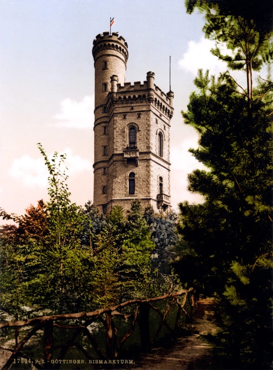 an old tower is shown at the end of a path