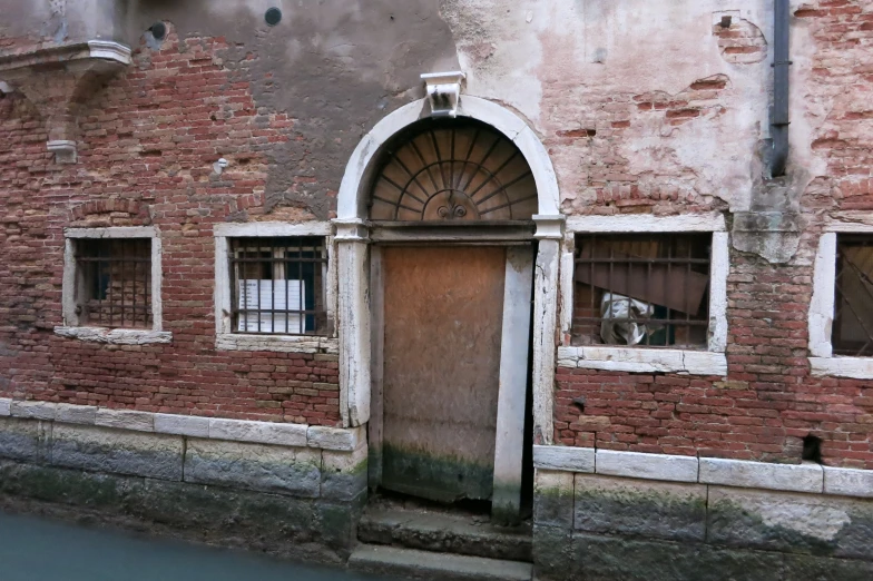 a very old building with an open door