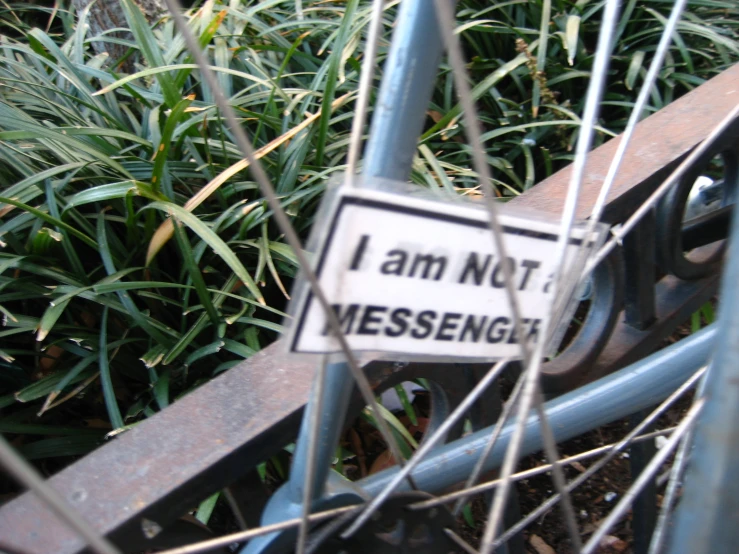 a metal barricade with grass surrounding it