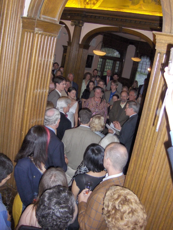 a group of people are standing in the doorway of a building