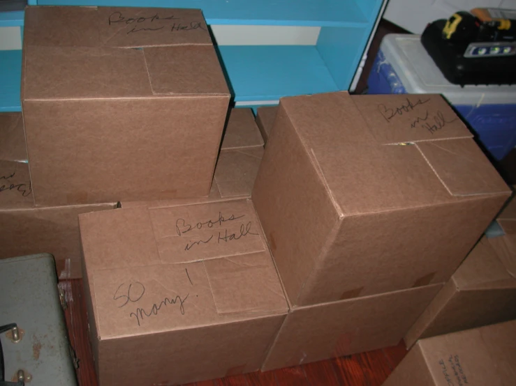 the boxes are full of small things and are labeled with people's names