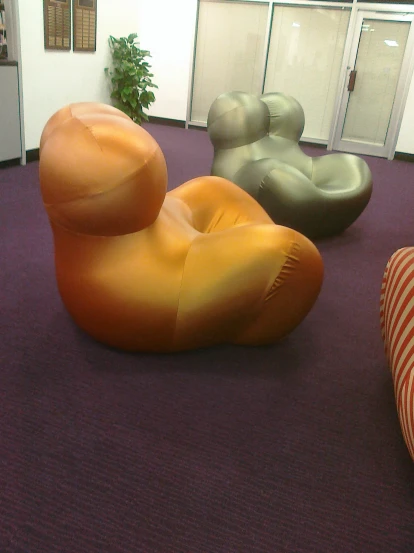 there are two sculptures in an office waiting area