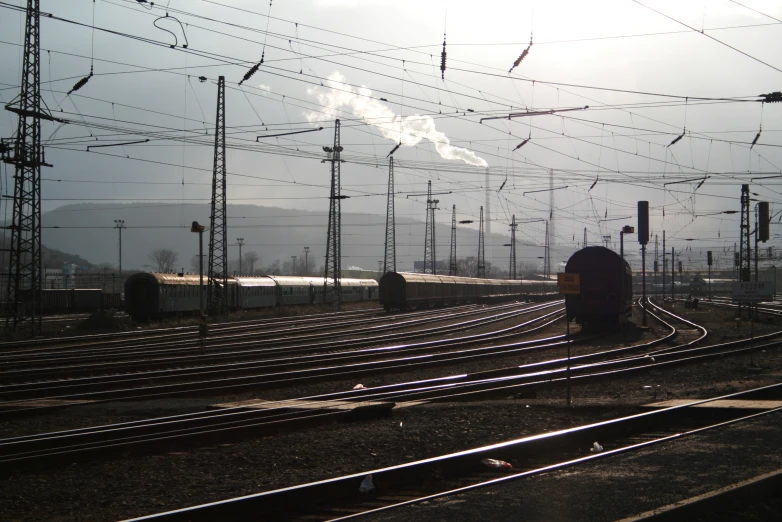 a train engine on the railroad tracks next to several buildings