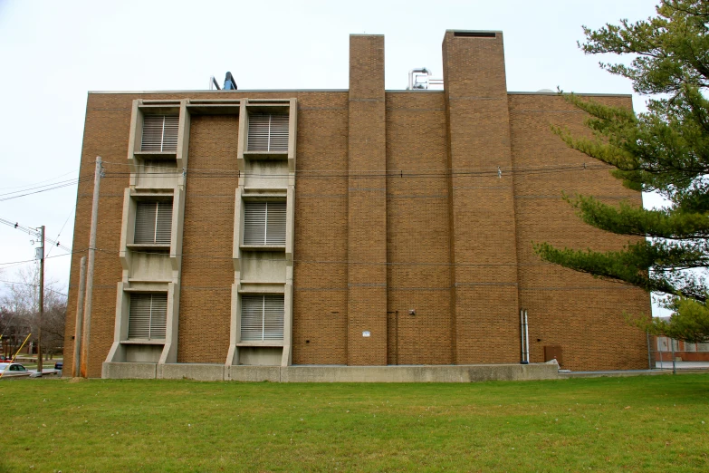 the building has windows and balconies above them