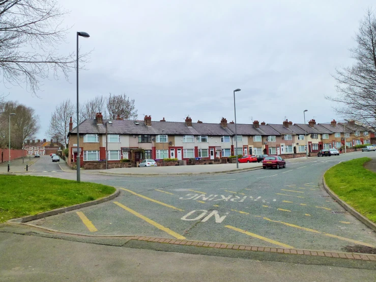 some cars are parked in front of some houses