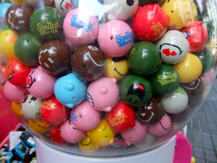 a gummy machine filled with lots of different colored balls