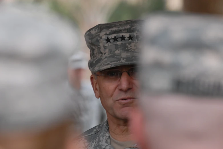 a man in uniform talking to some other men