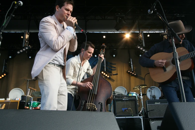 a band is performing on stage and playing instruments